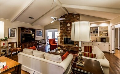 Living room with wood floors, vaulted ceiling, fir
