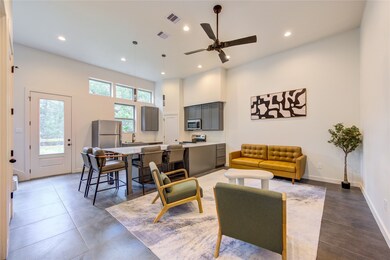 Tall 12’ ceilings and abundant windows provide a s