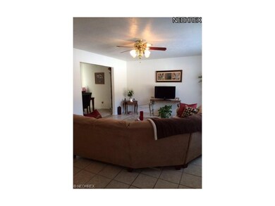 Living room with lots of natural sun light.  Newer