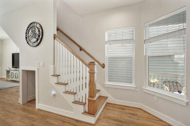 View of the stairs off of the front door and cute