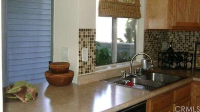 Window View of Balcony through Kitchen Window