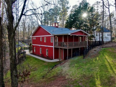 Rear view of property featuring a lawn