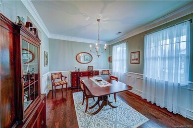 Formal dining room has upgraded wainscoting.