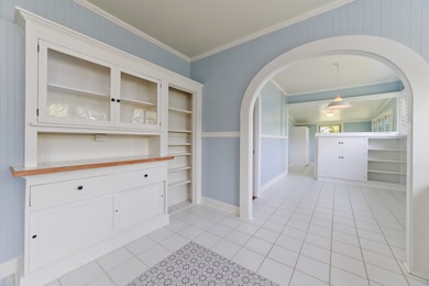 A kitchen with beautiful built-ions and arches
