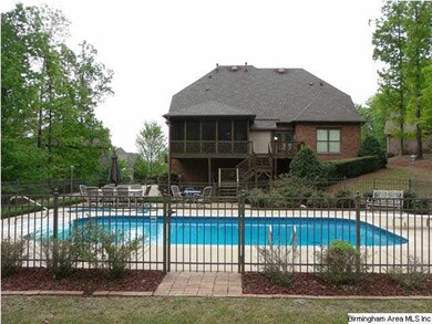A view of the pool and back of the house