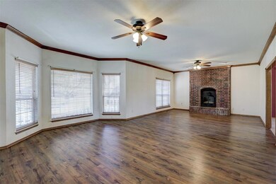 Large living area with extended windows and firepl