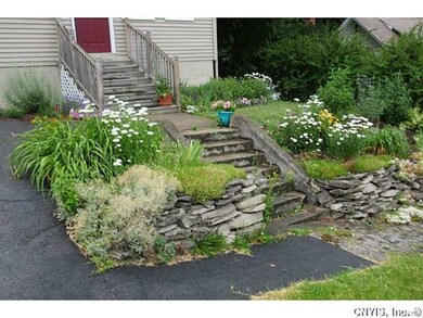 Front entry way with beautiful landscaping.