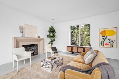 This stylish living room features an Isokern gas f