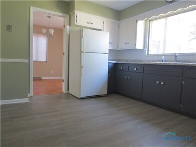 Eat in kitchen with trendy two tone cabinets