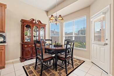 What a perfect spot for dining.  The partial bay window provides an unobstructed view to the outdoor space.