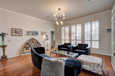 Living room with small hallway to Owner's retreat 