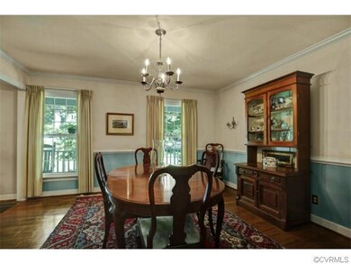 Formal Dining Room with Crown Molding and Chair Ra