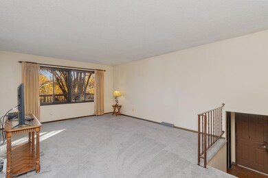 Large living overlooking deck to back yard