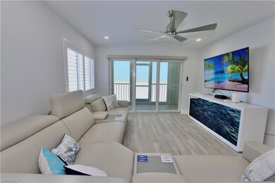 Living room with recessed lighting, ceiling fan, a