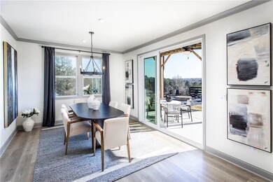 Dining area featuring baseboards, ceiling fan with
