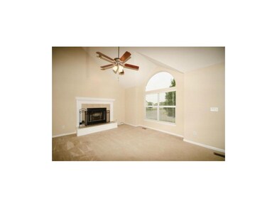 Roomy Great Room with fireplace and vaulted ceilin