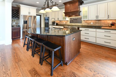 Kitchen with decorative backsplash, hardwood / woo