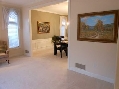 Living Room. The dining room with lovely wainscoti