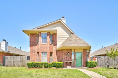 Traditional-style house featuring brick siding, a 
