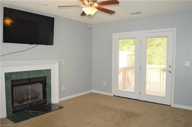 Gas log fireplace with marble surround and mantle. Doors open to backyard deck great for entertaining!