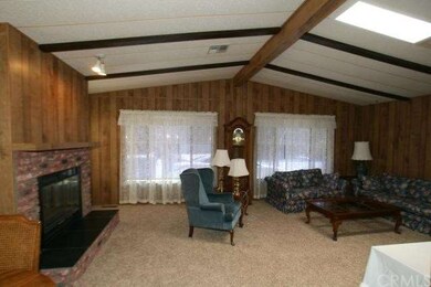 Living Room with Brick Fireplace