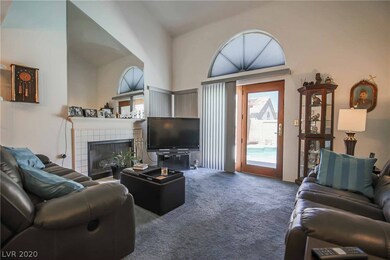 Living room features 16' vaulted ceiliing, firepla