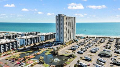 Aerial view of a nearby body of water and apartment complex