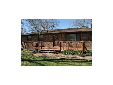 Welcoming Front Deck, Storm Door and Mature Landsc