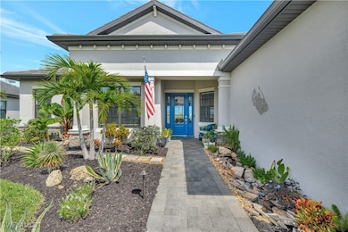 View of exterior entry featuring stucco siding