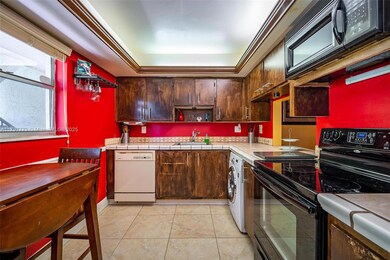 Kitchen walls are painted white.