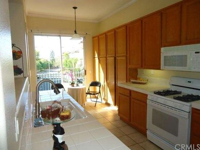 This terrific kitchen has counter top and cabinet 