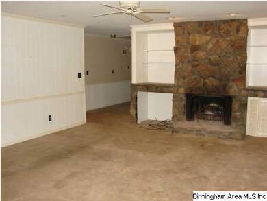 Enjoy the stone wood burning fireplace in the den