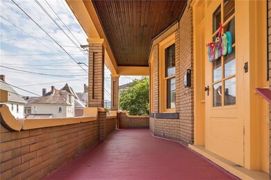 Covered front porch to sip your favorite beverage 