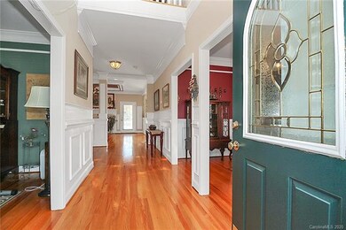 Entry Hall displays the abundant crown, chair rail