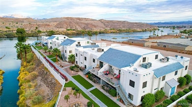 Birds eye view of property with a water and mountain view