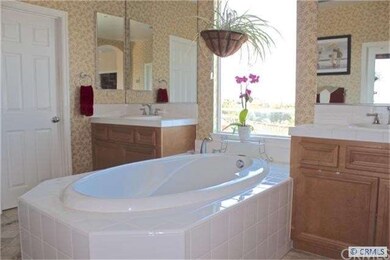 Relax in the huge master bathroom tub while you ga