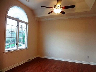 Exterior Front. Vaulted ceiling and a ceiling fan.