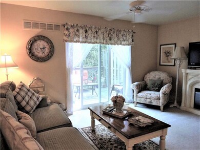 Large Living Room Area With Sliding Glass Doors to