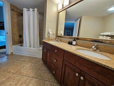 Bathroom with tile patterned floors, vanity, and s