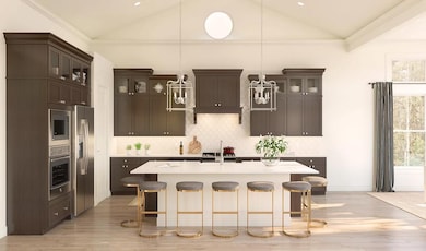 Kitchen with island, pendant lighting, glass-front upper cabinets and volume ceiling
