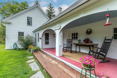 A Long Covered Porch Welcomes You Home and Provides A Sunny Spot to Rest