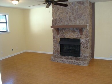 Living Room -laminate hardwood and stone fireplace