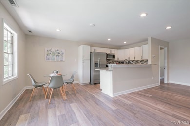 Kitchen featuring stainless steel appliances, ligh