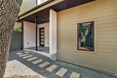 View of exterior entry with uncovered parking
