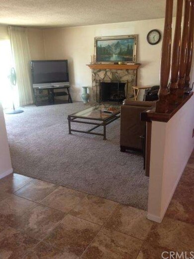 Living room - notice fireplace, new tile & new car