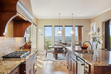 Kitchen with a sink, light wood-style flooring, s