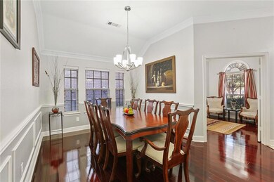 Hard wood flooring adds a COZY warmth to this dini