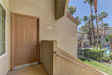 Property entrance featuring stucco siding