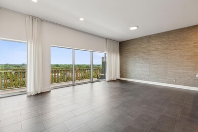 Living room featuring dark tile flooring with tree