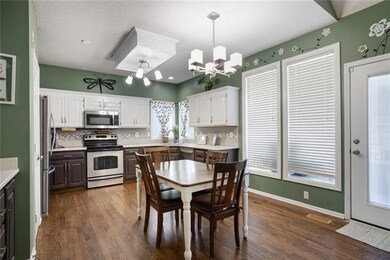 The kitchen has lots of cabinet space as well as c